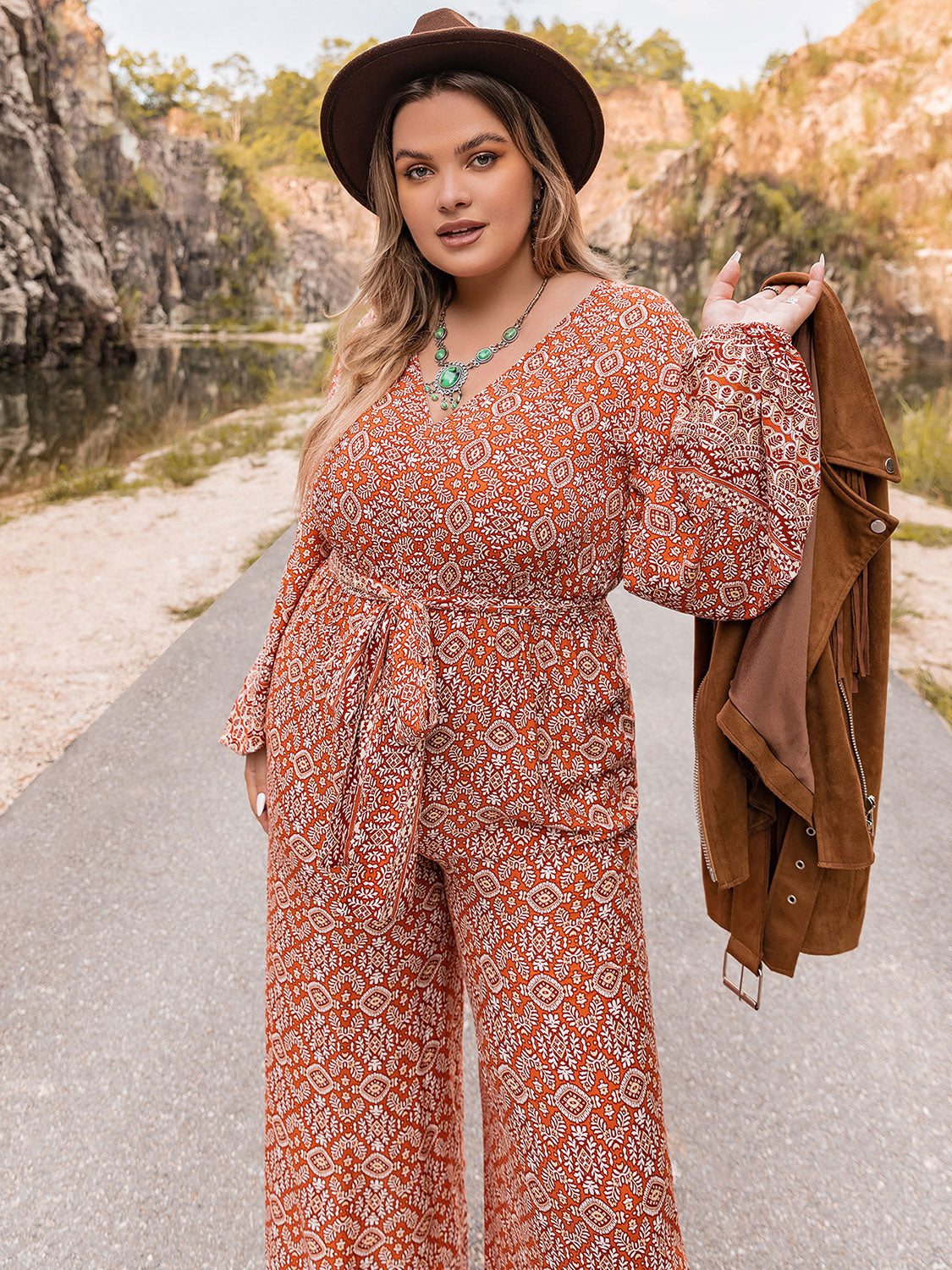 Plus Size Printed V-Neck Tie Front Balloon Sleeve Jumpsuit Sunset and Swim   