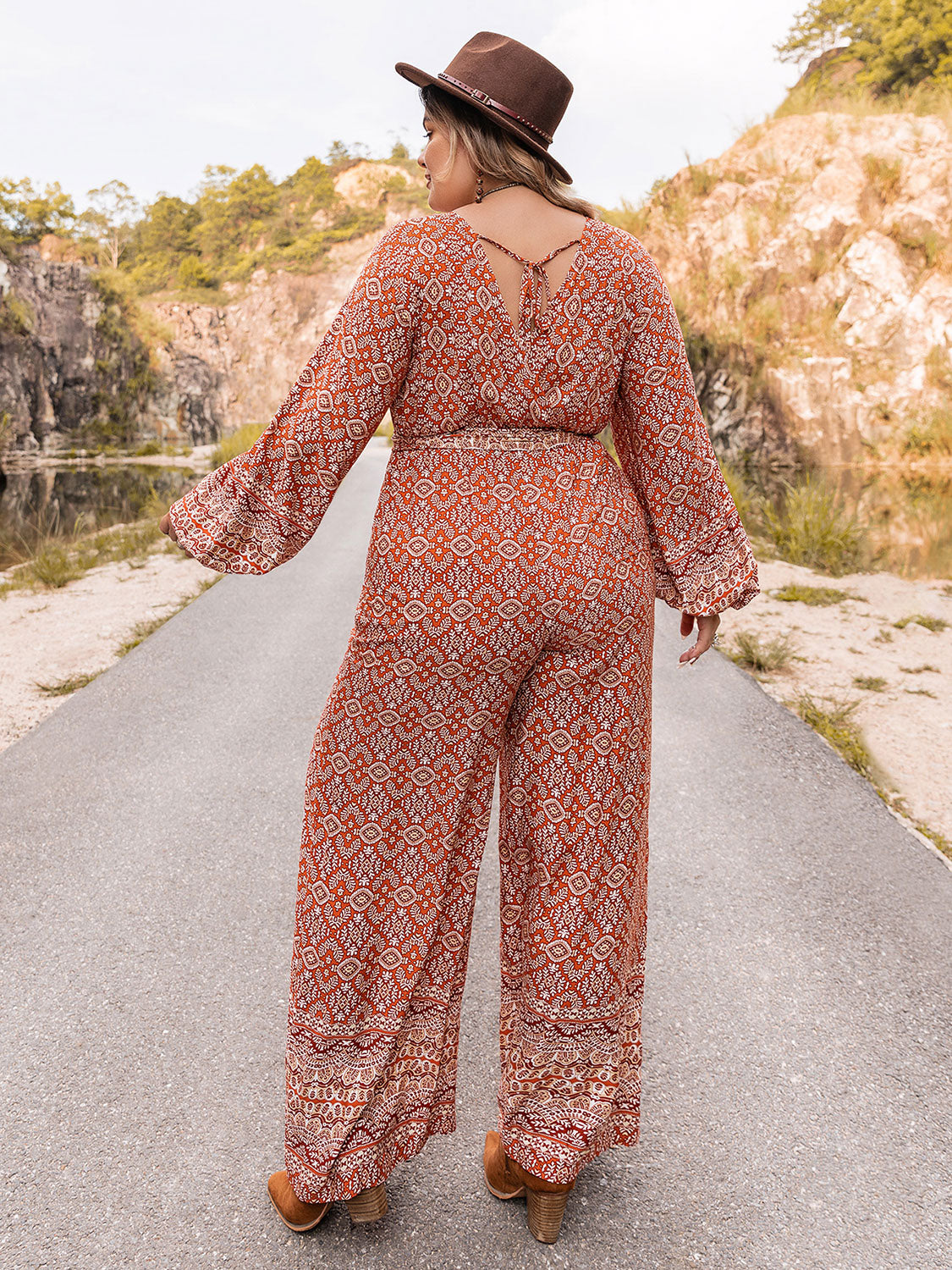 Plus Size Printed V-Neck Tie Front Balloon Sleeve Jumpsuit Sunset and Swim   