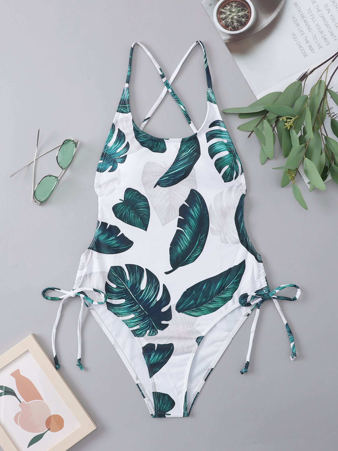 https://sunsetandswim.com/cdn/shop/products/jungle-vibes-sexy-back-drawstring-one-piece-swimsuit-386926_1445x.jpg?v=1660586629