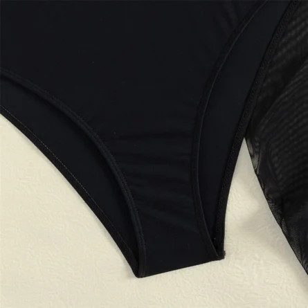 Elegant Black Swimsuit with Chic Sarong and Strappy Detail - Image 6